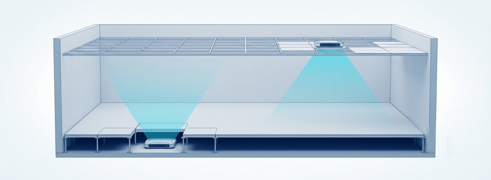 Installation locations: a cutaway of an office space with one locator fitted in the void beneath a raised access floor (one floor panel lifted to reveal it) and another sitting above a suspended ceiling grid (one tile slid aside to reveal it); each emits a cyan coverage cone that passes through the panel and the tile into the occupied space, which itself stays clean with no exposed equipment